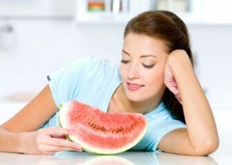 A girl fights excess weight with a watermelon diet. 